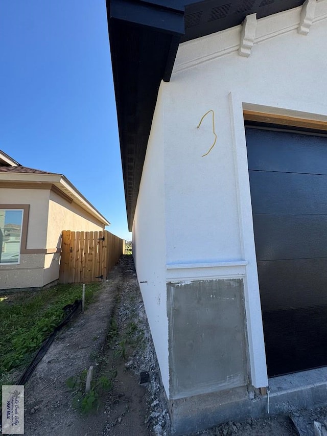 view of property exterior featuring a garage