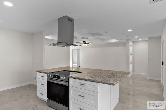 kitchen featuring stainless steel electric range, white cabinetry, island exhaust hood, light stone counters, and a kitchen island