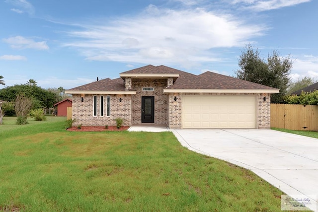 view of front facade featuring a garage and a front yard