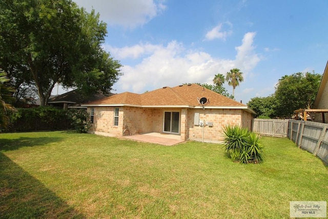 2602 E Mark Cir, Harlingen, TX 78550 - rear view of house with a patio