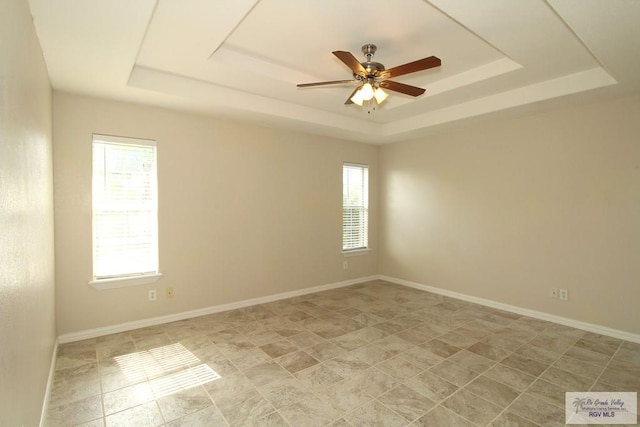 2602 E Mark Cir, Harlingen, TX 78550 - unfurnished room featuring a raised ceiling, healthy amount of natural light, and ceiling fan
