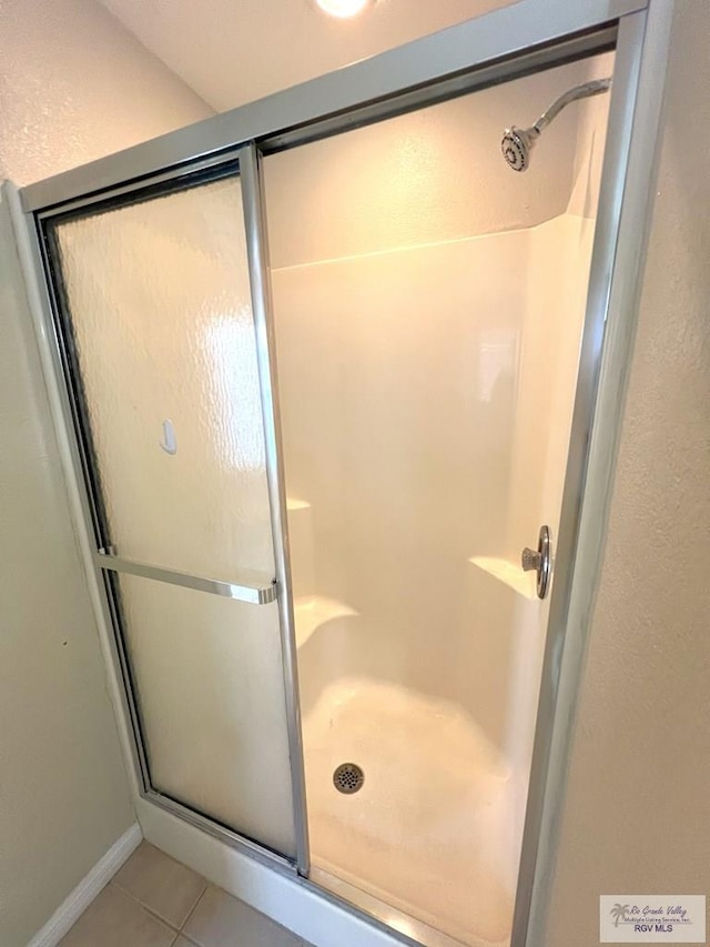 2602 E Mark Cir, Harlingen, TX 78550 - bathroom with a shower stall and tile patterned flooring