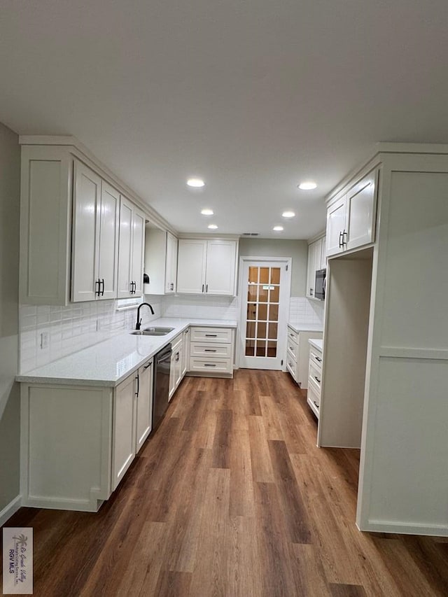 kitchen featuring dishwasher, white cabinets, and dark wood-type flooring