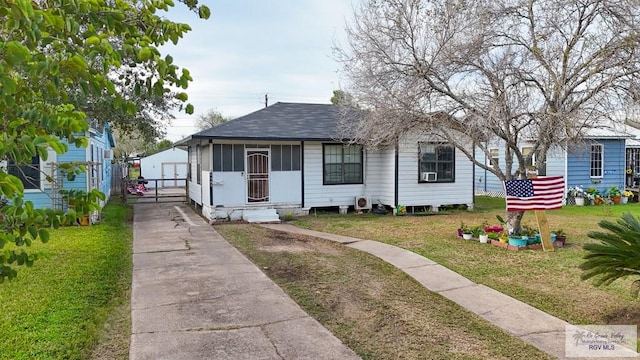 bungalow-style house featuring a front yard