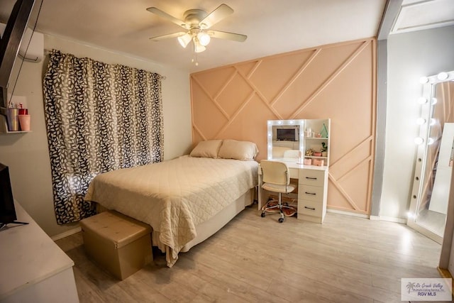 bedroom with ceiling fan and light hardwood / wood-style flooring