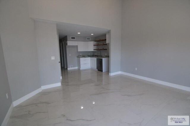 200 Padre Blvd Unit 2306, Port Isabel, TX 78597 - unfurnished living room featuring light marble finish flooring
