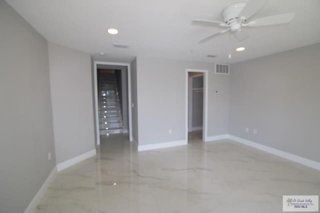 200 Padre Blvd Unit 2306, Port Isabel, TX 78597 - unfurnished room featuring a ceiling fan, light marble finish floors, and recessed lighting