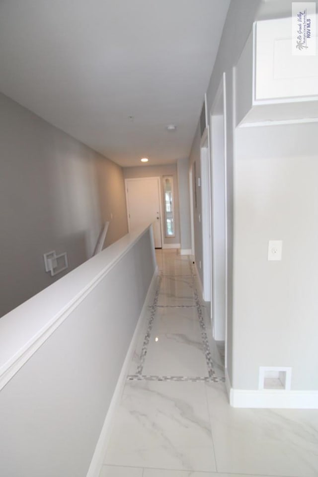 200 Padre Blvd Unit 2306, Port Isabel, TX 78597 - hallway with light marble finish flooring, recessed lighting, and an upstairs landing