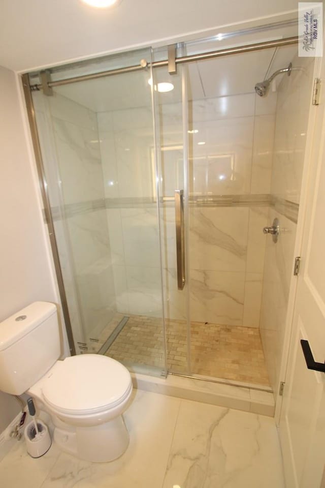 200 Padre Blvd Unit 2306, Port Isabel, TX 78597 - bathroom with marble finish flooring and a shower stall
