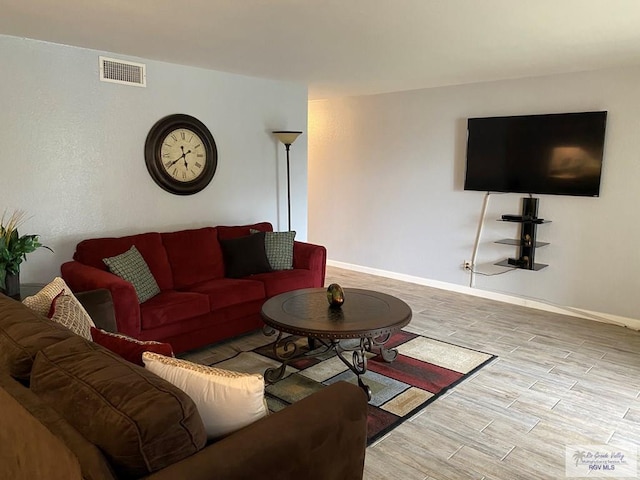 2010 El Dorado Ave, Rancho Viejo, TX 78575 - living area featuring wood finished floors and baseboards