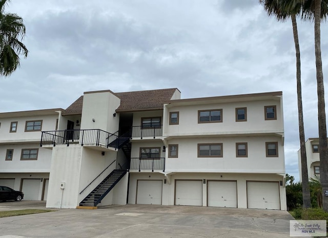 2010 El Dorado Ave, Rancho Viejo, TX 78575 - view of property with stairway, a garage, and driveway
