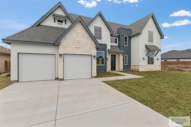 view of front of house with a front lawn and a garage