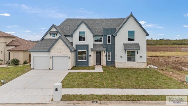 view of front facade featuring a garage and a front lawn