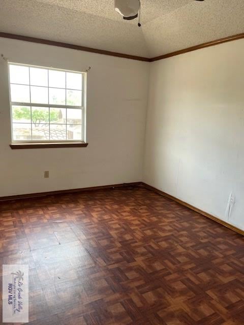 unfurnished room featuring a textured ceiling, baseboards, and ornamental molding