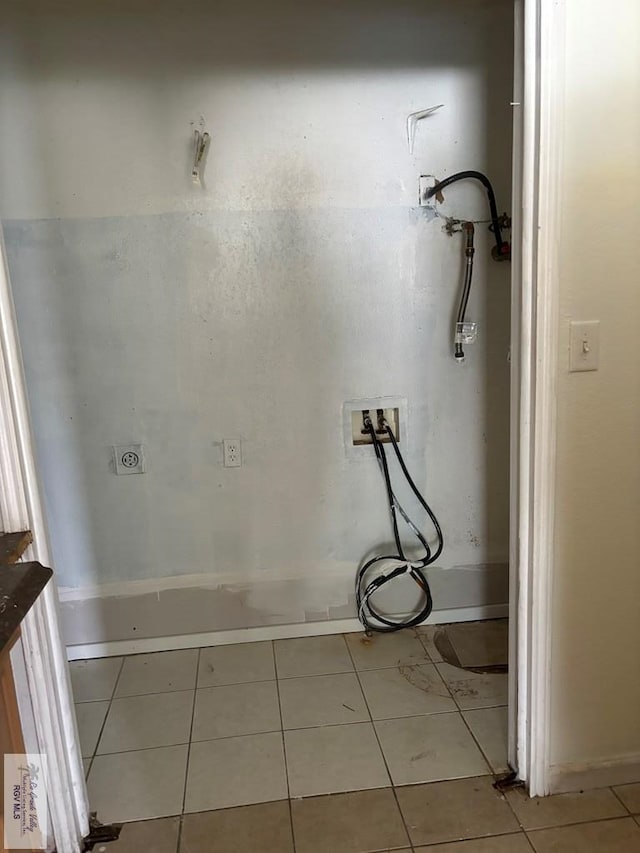 bathroom with tile patterned floors