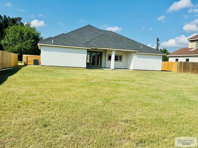 534 Billy Mitchell Blvd, Brownsville, TX 78520 - back of house with roof with shingles, stucco siding, and french doors