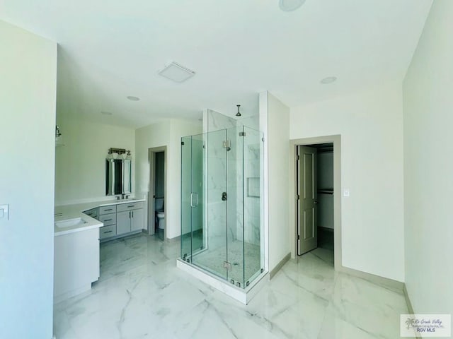 534 Billy Mitchell Blvd, Brownsville, TX 78520 - bathroom featuring a marble finish shower, marble finish flooring, and vanity