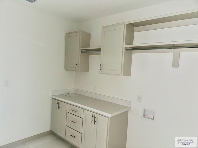 534 Billy Mitchell Blvd, Brownsville, TX 78520 - laundry room with hookup for a washing machine and baseboards