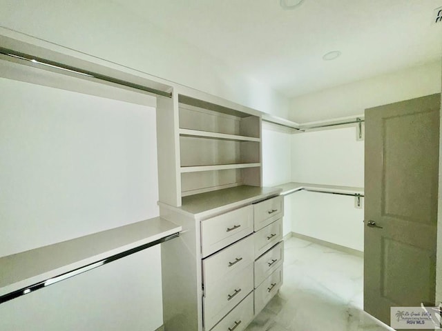 534 Billy Mitchell Blvd, Brownsville, TX 78520 - walk in closet with light marble finish flooring