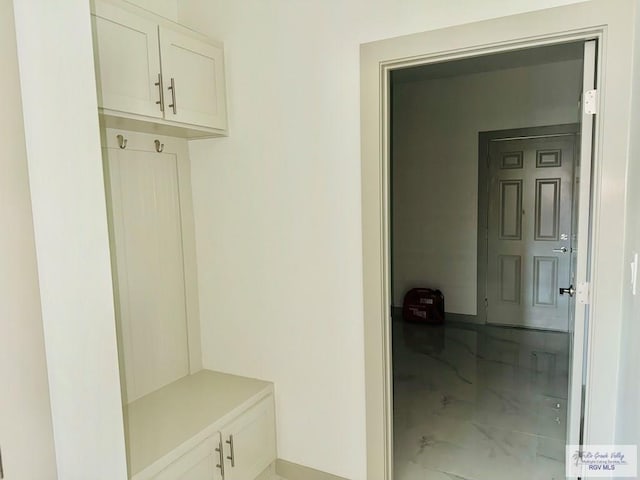 534 Billy Mitchell Blvd, Brownsville, TX 78520 - mudroom featuring marble look tiles and baseboards