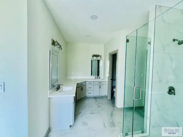 534 Billy Mitchell Blvd, Brownsville, TX 78520 - bathroom with a shower stall, marble finish floors, and vanity