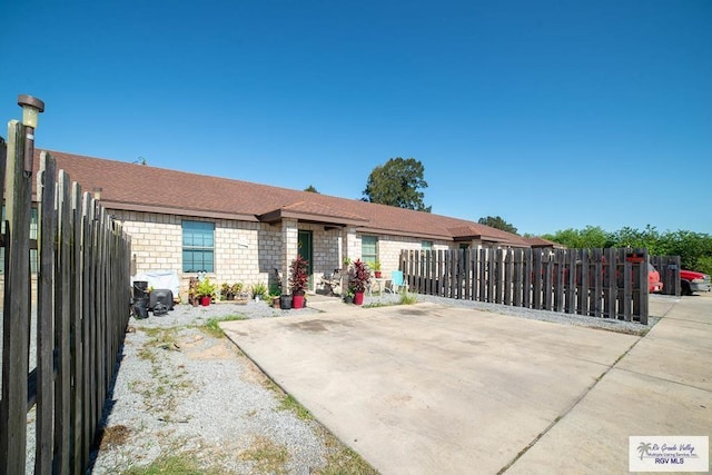 single story home featuring a patio area