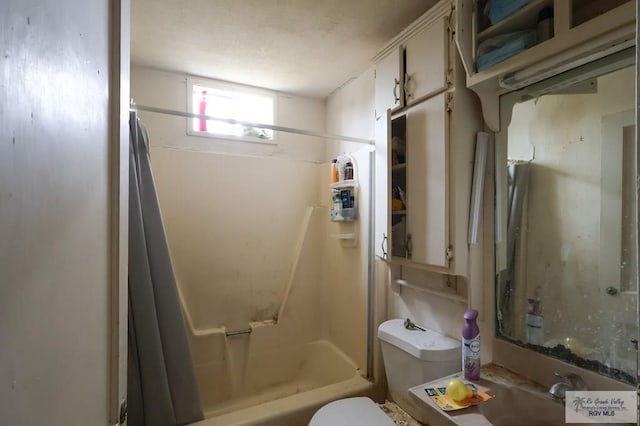 full bathroom with sink, shower / tub combination, and toilet