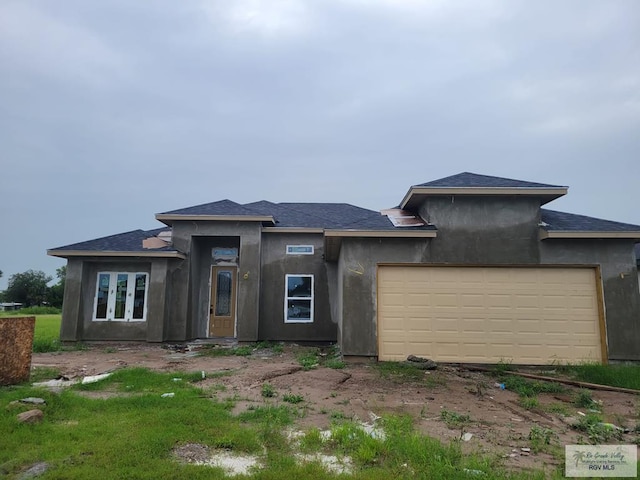 prairie-style home with a garage