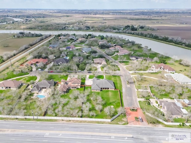 100 Paloma St, San Benito, TX 78586 - drone / aerial view with a residential view and a water view
