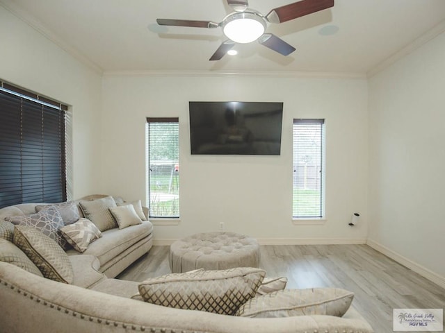 100 Paloma St, San Benito, TX 78586 - living room featuring baseboards, wood finished floors, ornamental molding, and a ceiling fan