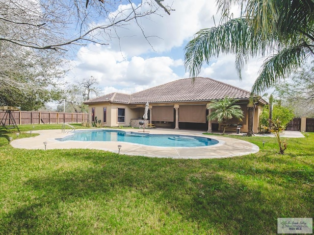 100 Paloma St, San Benito, TX 78586 - view of swimming pool with a patio, a yard, fence, and a fenced in pool