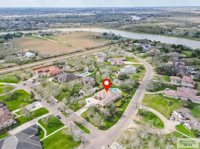100 Paloma St, San Benito, TX 78586 - aerial view featuring a water view and a residential view