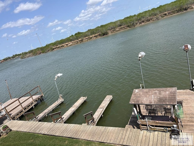 view of dock featuring a water view and boat lift