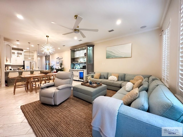 107 E Palm St Unit B, South Padre Island, TX 78597 - living area with visible vents, light tile patterned floors, ceiling fan with notable chandelier, and crown molding