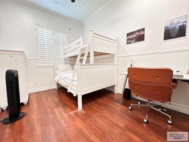 107 E Palm St Unit B, South Padre Island, TX 78597 - bedroom featuring wood finished floors, a wainscoted wall, and ornamental molding