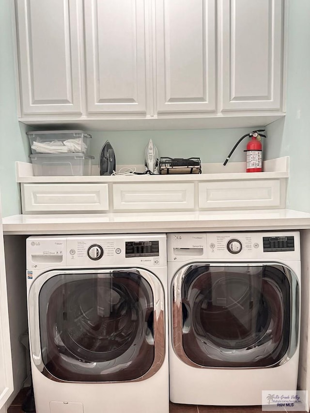 107 E Palm St Unit B, South Padre Island, TX 78597 - clothes washing area featuring washer and dryer and cabinet space