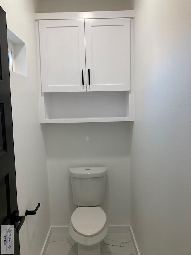 bathroom featuring toilet