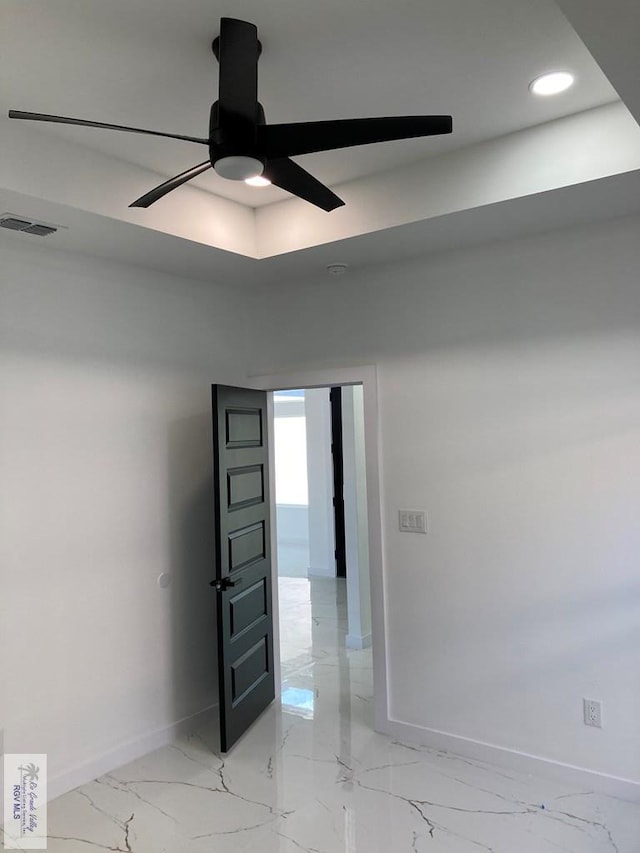 spare room with ceiling fan