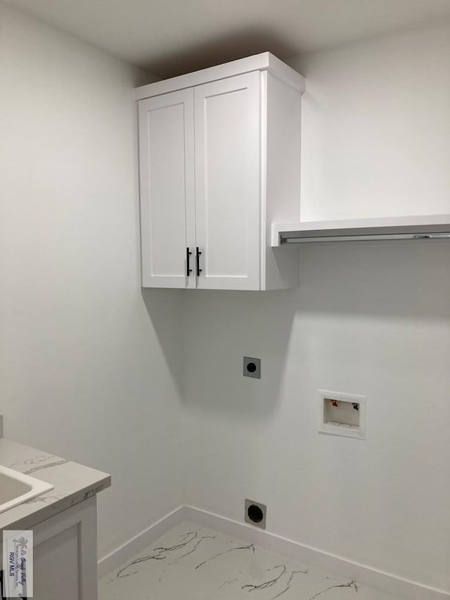 laundry room featuring electric dryer hookup, cabinets, and washer hookup