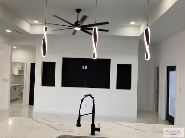 kitchen with ceiling fan and sink