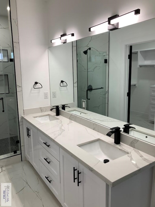 bathroom featuring vanity and a shower with shower door