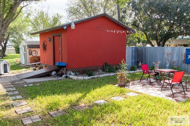 view of outbuilding featuring a yard