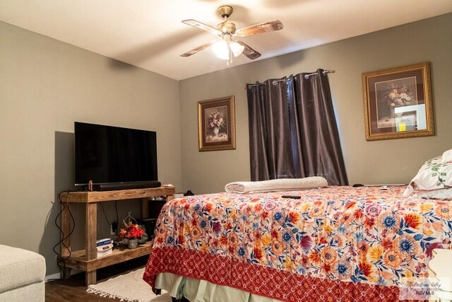 bedroom with hardwood / wood-style flooring and ceiling fan