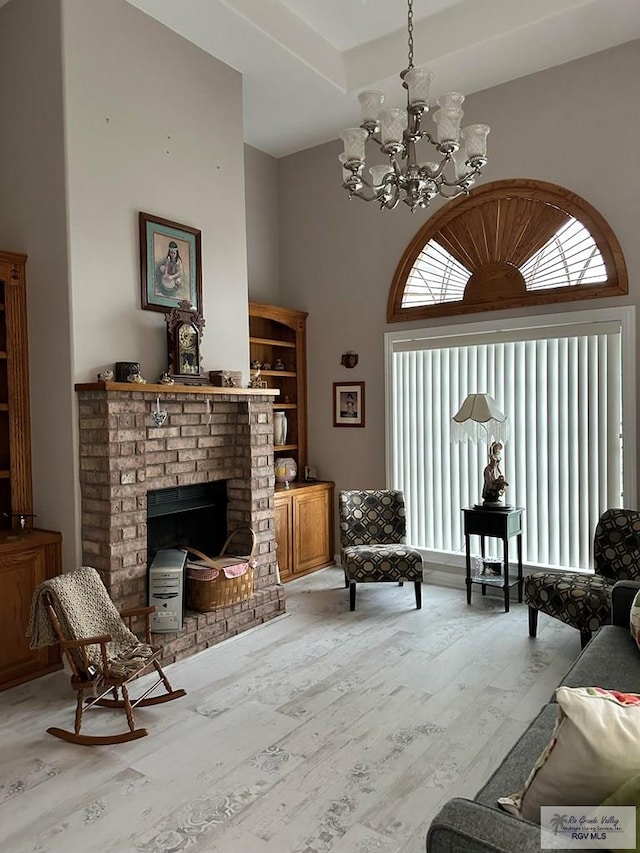 living room featuring a fireplace, wood-type flooring, and a healthy amount of sunlight