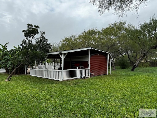 view of outdoor structure featuring a lawn