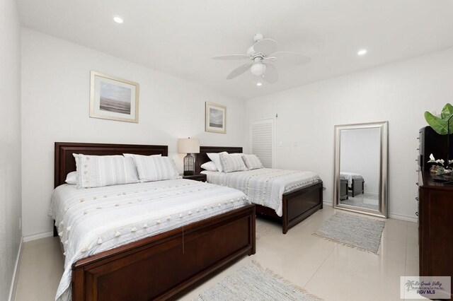 bedroom featuring ceiling fan and light tile patterned flooring