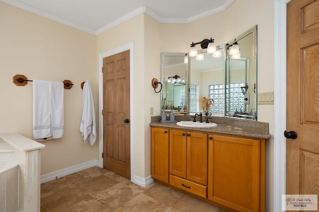 bathroom with vanity and crown molding