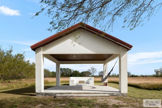 view of home's community with a gazebo and a yard