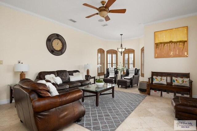 living room with ceiling fan and ornamental molding