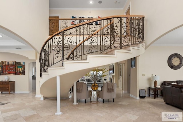 staircase with crown molding